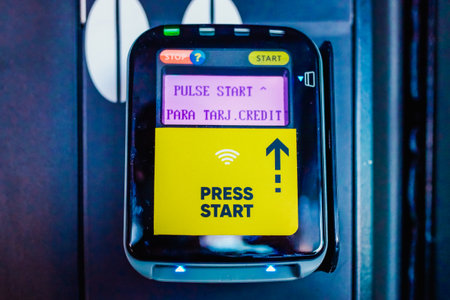 Valencia, Spain - October 2, 2021: A digital collection card reader, with the text Press hereのeditorial素材