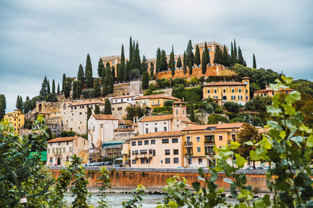 Verona, italy - october 1, 2021: Verona castle and houses around it, seen from the old city.のeditorial素材