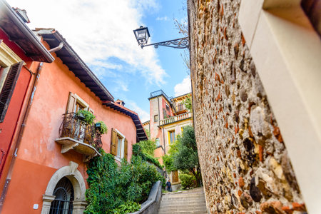 Verona, italy - october 1, 2021: alleys of Verona among which you can see the duomo and the castle.のeditorial素材