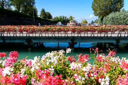 Peschiera del Garda, Italy - October 6, 2021: Bridge decorated with flowers over the lake that gives access to the city through the walls of Peschiera.の写真素材