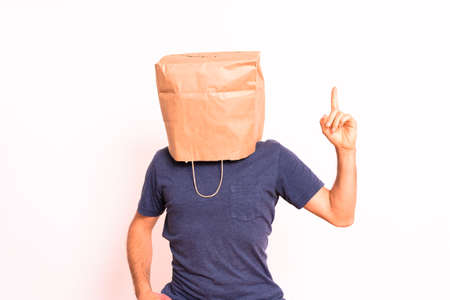 Anonymous pensive man with paper bag on his head.の写真素材