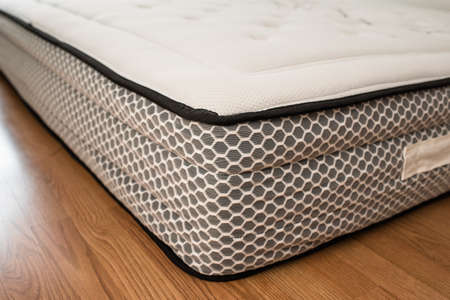 Detail of the spongy material of the upper fabric of a mattress for comfortable sleeping.の写真素材