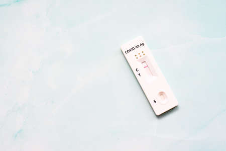A negative saliva rapid covid antigen test isolated on a white background.