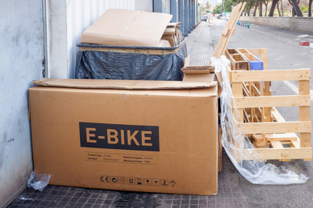 Valencia, Spain - December 28, 2021: After Christmas gifts, empty boxes accumulate as waste in the streets, box of an e-bike.のeditorial素材
