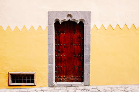 Nice wall painted in soft colors, with the frame of a traditional door.の写真素材