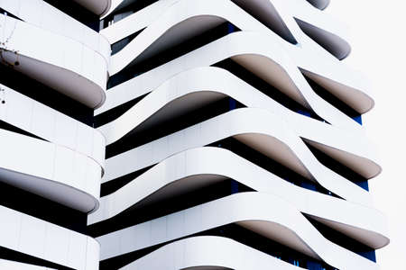 Modern building with terraces of simple lines and monochrome design with contemporary architecture