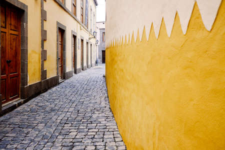 Colorful wall of houses on a narrow street in the touristic old town of Las Palmas on Gran Canaria.の写真素材