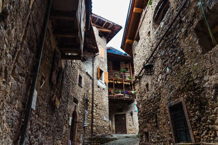 An old stone and rock village with houses still standing in the mountains of the Italian alpsの写真素材