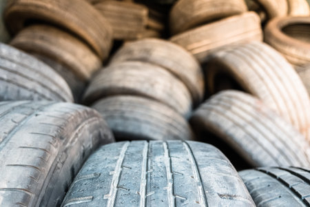 Detail of old used and retired tires, piled up in a treatment plant.の写真素材