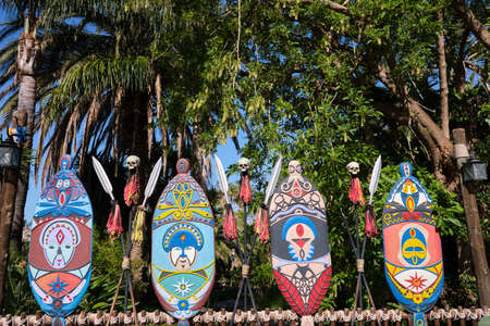 Traditional brightly colored Polynesian decorations on wooden boards.