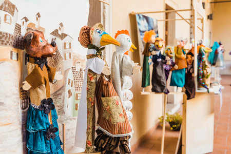 Colorful handmade Italian-style puppets in a children's theater performance.の写真素材