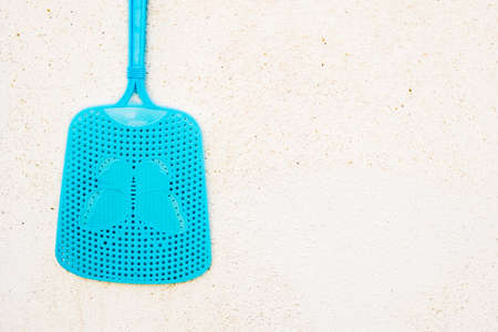 Detail of a plastic fly swatter, copy space.の写真素材