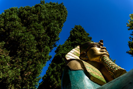 Peschiera di Garda, Italy - October 22, 2021: Imposing sculpture of a golden Egyptian sphinx exposed...
