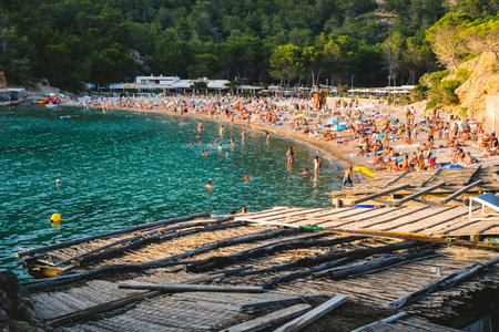 Ibiza, spain - july 28, 2022: Vacationers enjoy their vacations on the coast of the Ibiza islands on the delicious beaches.のeditorial素材