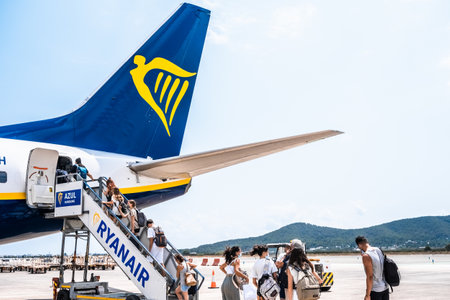 Ibiza, spain - July 25, 2022: Passengers starting their vacations by taking a flight from the low-cost airline Ryanair.のeditorial素材