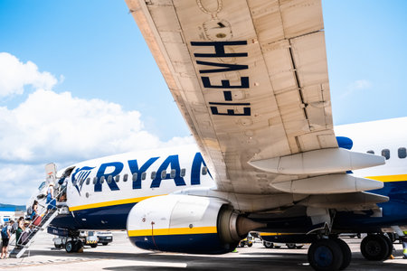 Ibiza, spain - July 25, 2022: Passengers starting their vacations by taking a flight from the low-cost airline Ryanair.のeditorial素材