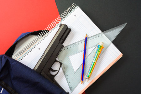 Students carry guns to class to protect themselves during shootings.の写真素材