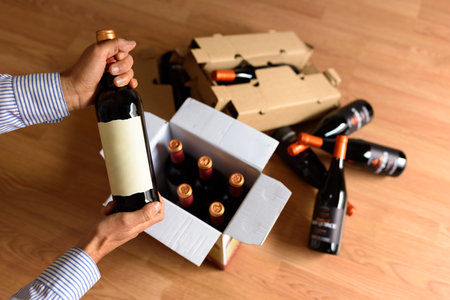 Cardboard box with quality wine bottles sent by postの写真素材