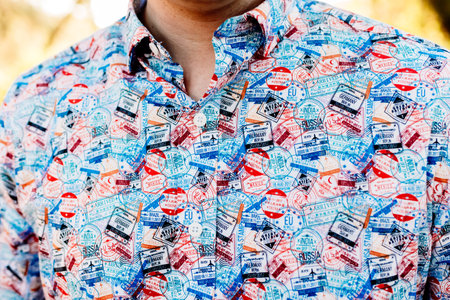 Detail of a shirt decorated with passport stamps, ideal for enthusiastic tourists.の写真素材