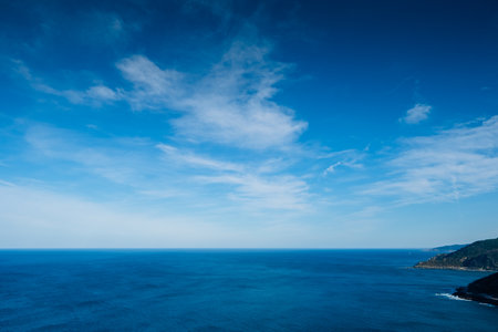 Calm and deep sea horizon seen from above, relaxation background.の写真素材