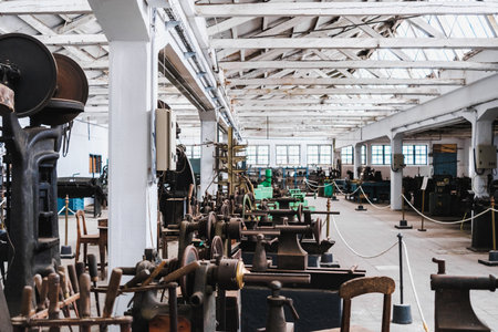 Interior of an old metalworking factory with metal lathes and presses.の写真素材