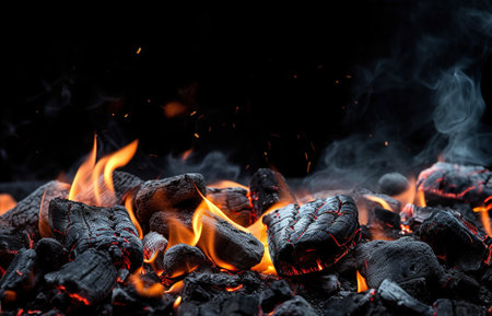 Some coal embers still with flames ready to prepare a barbecue. Ai generated.の素材