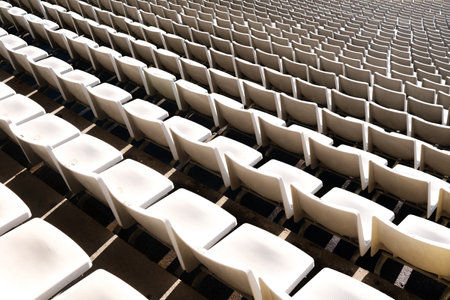 Rows of empty seats in a sports stadium.の写真素材