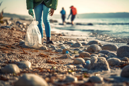 Volunteers collect trash and pollution from a beach after a storm. Ai generated.の素材