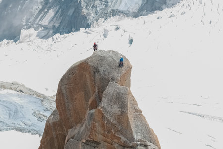 Climbers traverse mountain ridges and rocks near Montblanc.