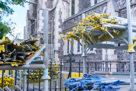Copenhagen, Denmark - August 8, 2023: Stacked bars for erecting scaffolding.