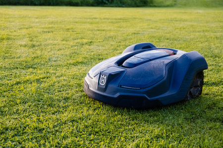 May, Ireland - August 2023: An advanced automatic lawn mower utilizes robotics to maintain lush green lawns effortlesslyのeditorial素材