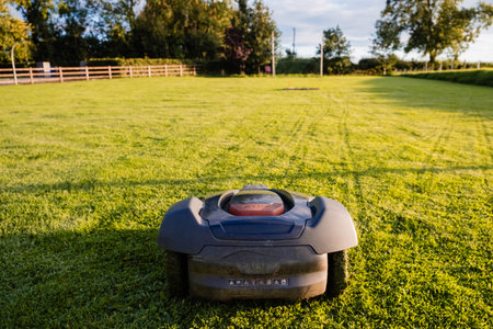 May, Ireland - August 2023: An advanced automatic lawn mower utilizes robotics to maintain lush green lawns effortlesslyのeditorial素材