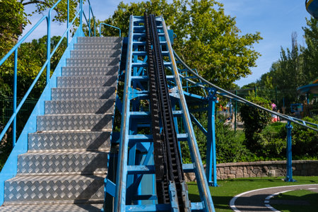 Lane on which an amusement train circulates, with a traction chain, outdoors.の写真素材