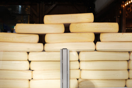 Raclette at a cheese street stall, delicious bite of traditional Swiss food.の写真素材