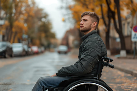 A young man, wounded by war, spends his days retired in a wheelchair bored.の素材