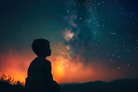 Child marvels at the beautiful starry sky on a star-viewing nightの素材