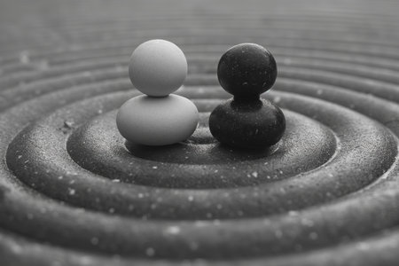 Decorative figurines in a garden, natural shapes molded in stone, zen background for meditation.の素材
