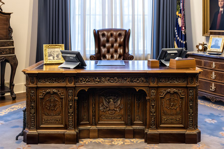 A spacious room showcases a large wooden desk, likely the centerpiece of an important office setting.の素材