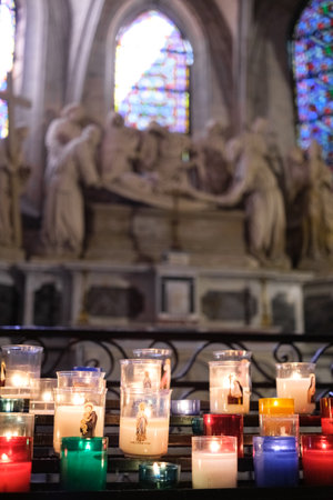 Colorful offering candles inside a churchの写真素材