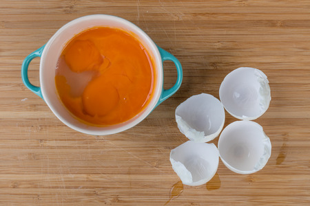 Break the eggs into a bowの写真素材