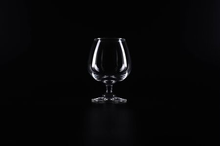 A wineglass on a black background.の写真素材