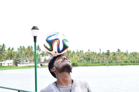 Young man with football.