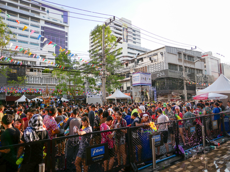 BANGKOK - APRIL 13: Tourists and local enjoy water splashing in Songkran Festival or Thai New Year between April 13-15, 2017 at Siam Square, Bangkok, Thailand.のeditorial素材
