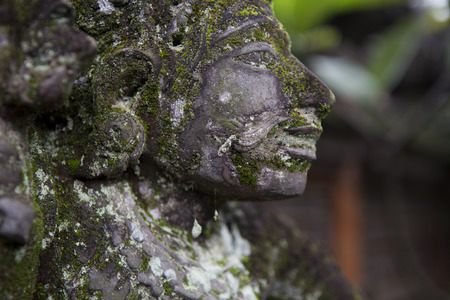 Close up of old religious statue guarding the door in Bali, Indonesiaの写真素材