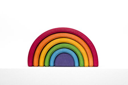 Rainbow wooden toy on white backgroundの写真素材