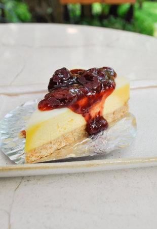 strawberry cheesecake dish on the tableの写真素材