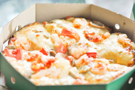 a box of seafood pizzaの写真素材