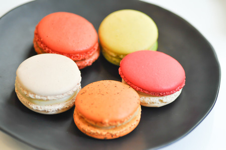 colorful macaroon dish on the tableの写真素材