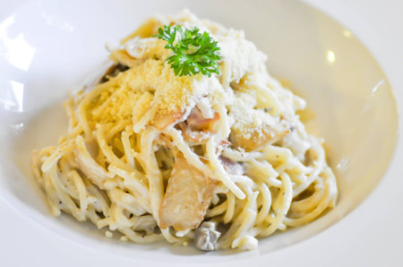 spaghetti cabonara on white dishの写真素材