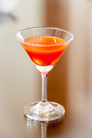 orange juice glass on the tableの写真素材